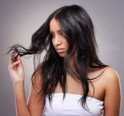 woman-checks-hair-ends